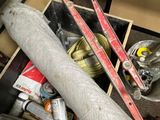 a pile of skis and ski poles in a box