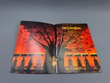 the lion king movie poster in an open book