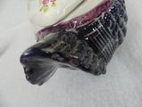 a black and white cat figurine sitting on a table