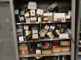 a shelf full of electronic equipment in a room