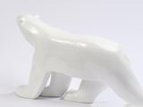 a white polar bear figurine on a white background