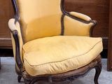 a yellow chair that is sitting in a room