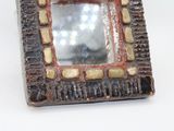 a picture of a picture of a mirror on a table