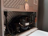 an air conditioner sitting on top of a white counter
