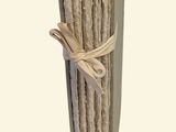 a bunch of sticks tied up to a pole