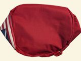 a red bag with a flag on it sitting on a table