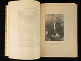 an open book with a picture of a man sitting on a bench