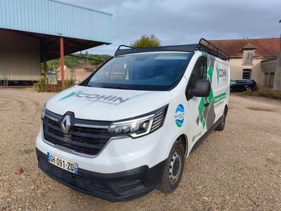 a white van that is parked in front of a building