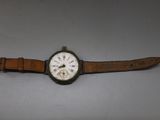 an image of a wrist watch sitting on top of a table