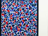 painting of red, white, and blue paint splattered on a black frame