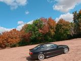 a car that is parked in the middle of a field
