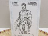 a box with a drawing of a man in a superman costume