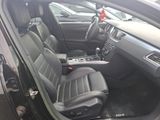 the interior of a car with black leather seats and a center console