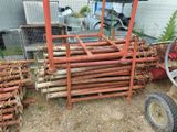 a pile of rusty pipes and pipes in a yard
