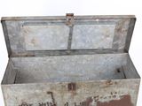 an old metal box with writing on it