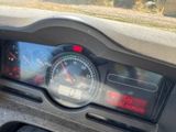 a close up of a car dashboard with a speedometer