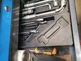 many tools in a tool box on the table