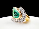an image of a green and white diamond ring