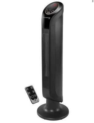 un radiateur colonne noir posé à côté d'une télécommande