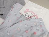 two pajamas and a t - shirt sitting on a table