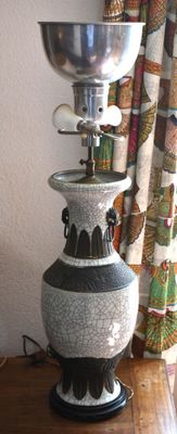 a lamp that is on top of a wooden table