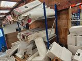 a pile of boxes that are stacked up in a room