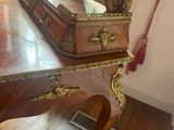 a wooden desk with a mirror on top of it