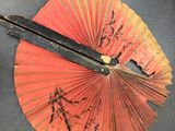 a pair of scissors that are on top of a fan