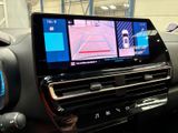 the dashboard of a car with a gps device in the center of it