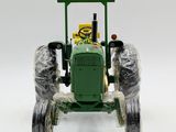 a toy tractor that is covered in plastic wrap