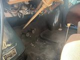 a view of the inside of a car with a steering wheel