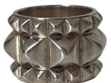 a close up of a silver ring on a white background