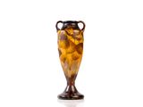 a vase that is sitting on a white surface