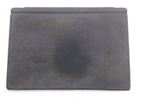a black tablet that is sitting on a white surface