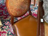 a chair that is sitting on a rug in a room