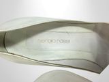 a close up of a pair of shoes on a white surface