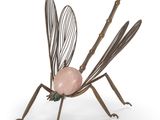 a close up of a sculpture of a mosquito with a ball on its back