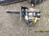 an image of a chainsaw and a chainsaw on the ground