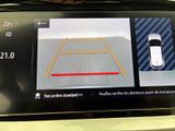 a picture of a car ' s rear view mirror with a camera on it