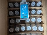 a cardboard box filled with bottles of water and a bottle of liquid