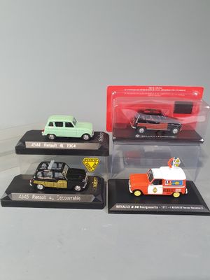 four different models of cars on display in a display case