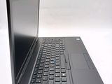 a laptop with a keyboard on a white surface