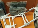 a skeleton sitting on top of a table next to other items