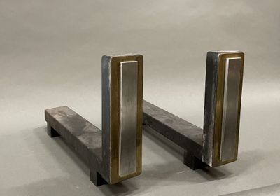 two metal bookends that are sitting on a table