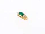 an oval emerald and diamond ring