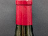 a bottle of wine that is sitting on a table