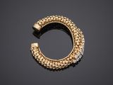 a gold and diamond hoop earring