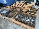 many different types of metal in crates on a pallet