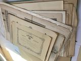 a pile of old papers on top of a table