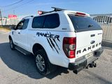 a white pick up truck parked on the side of the road
